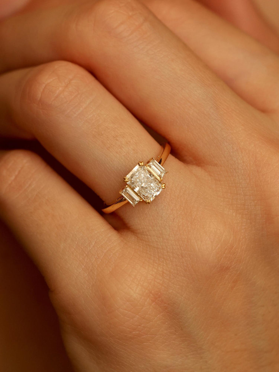 Radiant cut lab grown diamond three stone engagement ring, 1.20 to 3.20 carats, set in prong design on polished gold band