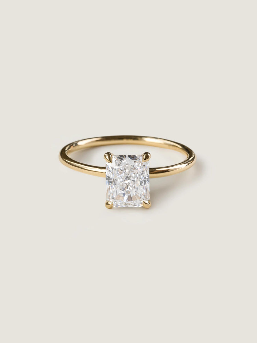 Radiant cut lab grown diamond solitaire engagement ring, 1.50 to 3.50 carats, in a classic prong setting on polished gold band