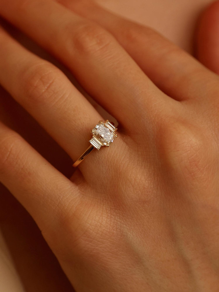 Radiant cut lab grown diamond three stone engagement ring, 1.20 to 3.20 carats, set in prong design on polished gold band