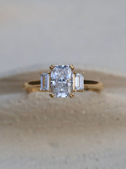 Radiant cut lab grown diamond three stone engagement ring, 1.20 to 3.20 carats, set in prong design on polished gold band