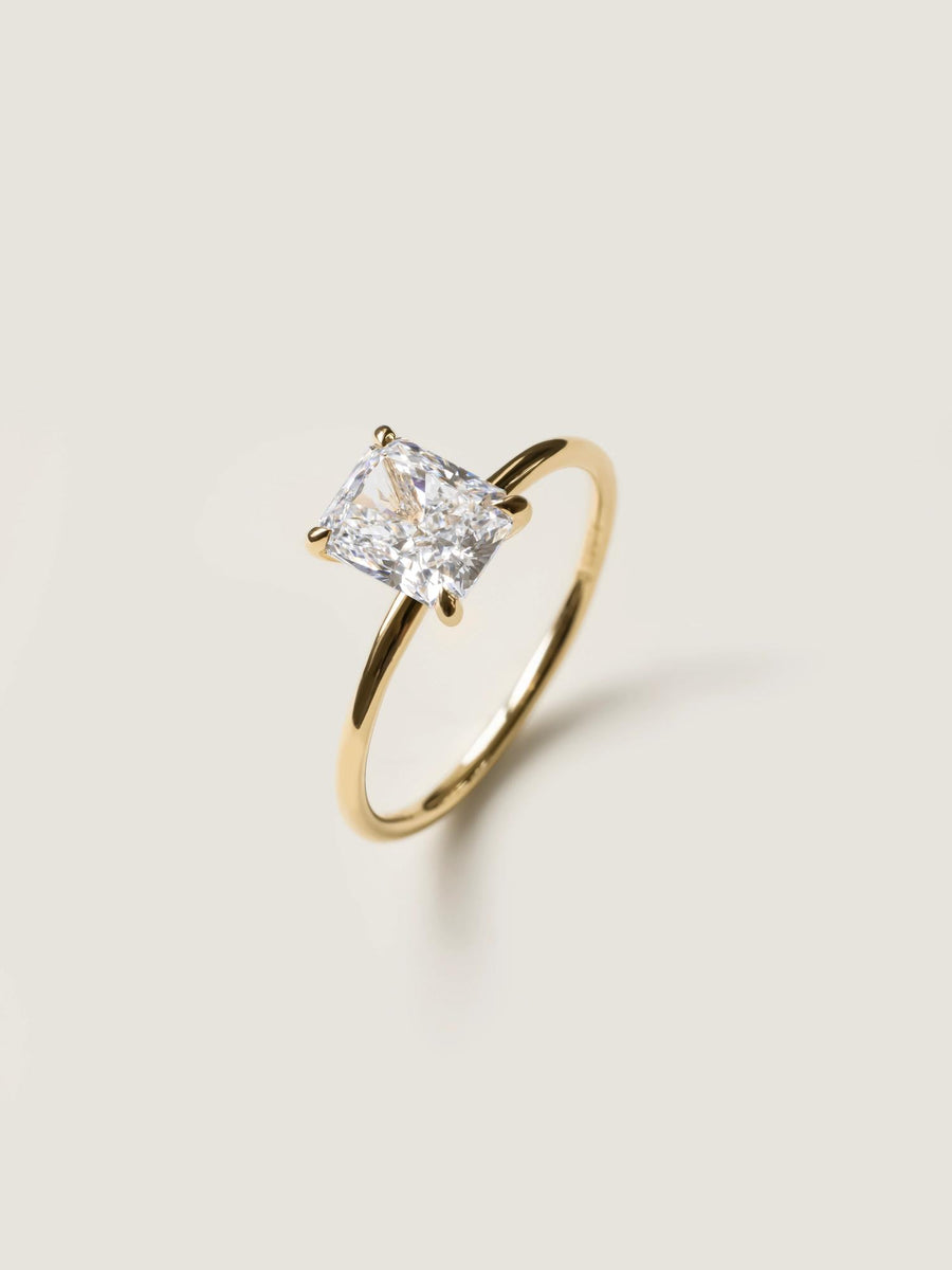 Radiant cut lab grown diamond solitaire engagement ring, 1.50 to 3.50 carats, in a classic prong setting on polished gold band
