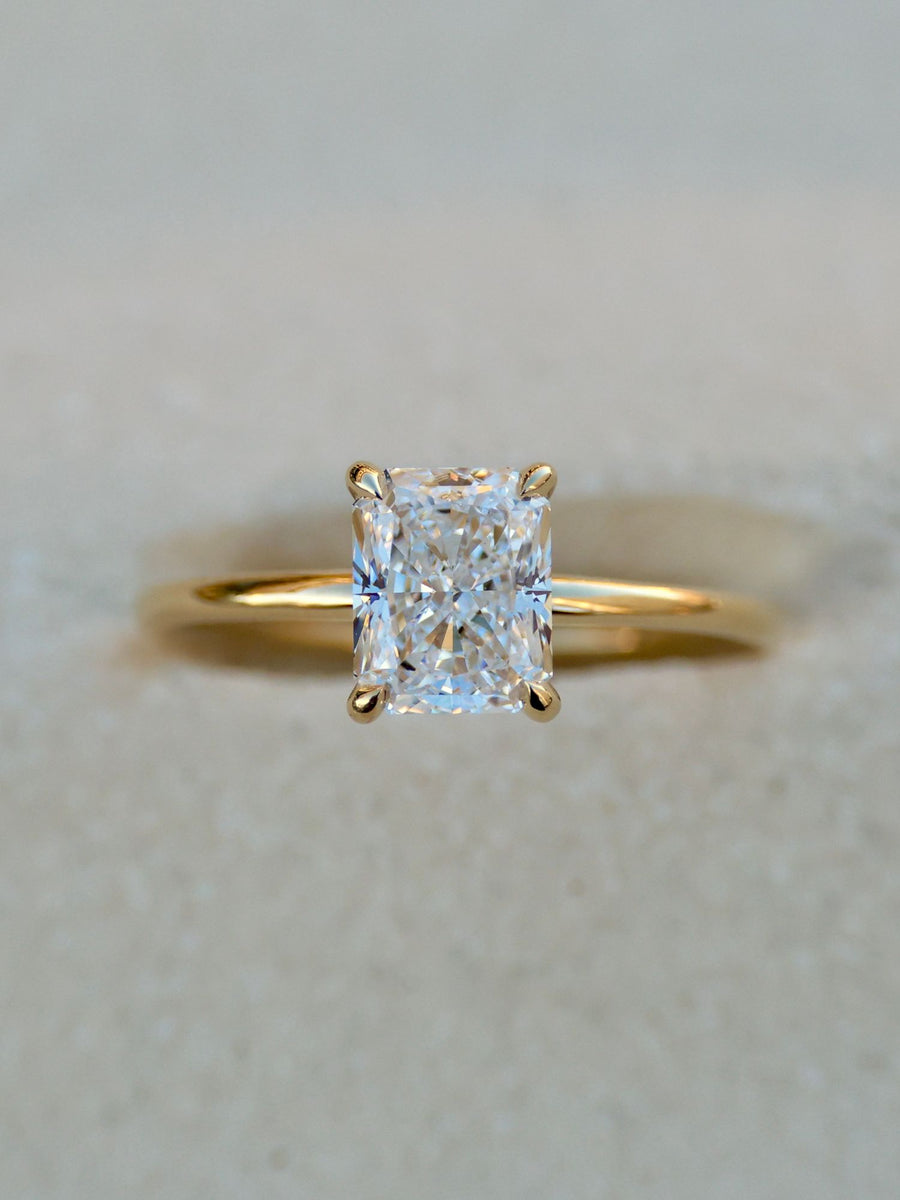 Radiant cut lab grown diamond solitaire engagement ring, 1.50 to 3.50 carats, in a classic prong setting on polished gold band