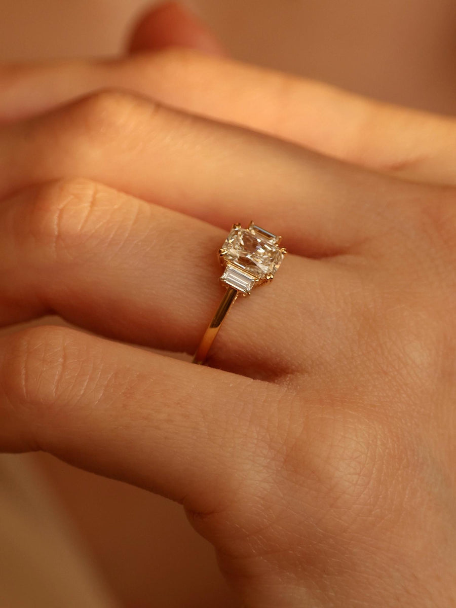 Radiant cut lab grown diamond three stone engagement ring, 1.20 to 3.20 carats, set in prong design on polished gold band