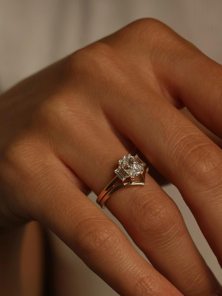 Radiant cut lab grown diamond three stone engagement ring, 1.20 to 3.20 carats, set in prong design on polished gold band