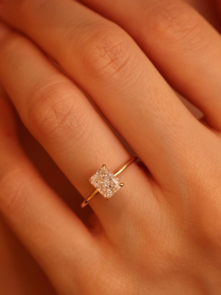 Radiant cut lab grown diamond solitaire engagement ring, 1.50 to 3.50 carats, in a classic prong setting on polished gold band