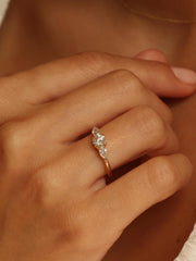 0.50 carat round cut lab grown diamond three stone engagement ring with prong setting on polished gold band