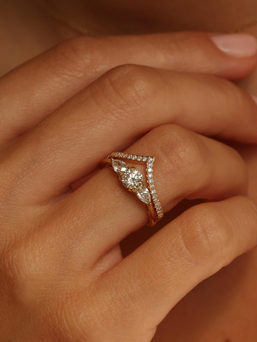 0.50 carat round cut lab grown diamond three stone engagement ring with prong setting on polished gold band