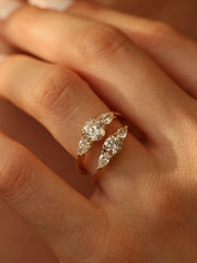 0.50 carat round cut lab grown diamond three stone engagement ring with prong setting on polished gold band