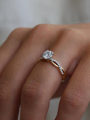 Round cut lab grown diamond twisted engagement ring, 0.70 to 2.50 carats, set in prong design with intertwined gold band
