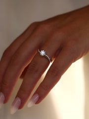 Round cut lab grown diamond twisted engagement ring, 0.70 to 2.50 carats, set in prong design with intertwined gold band