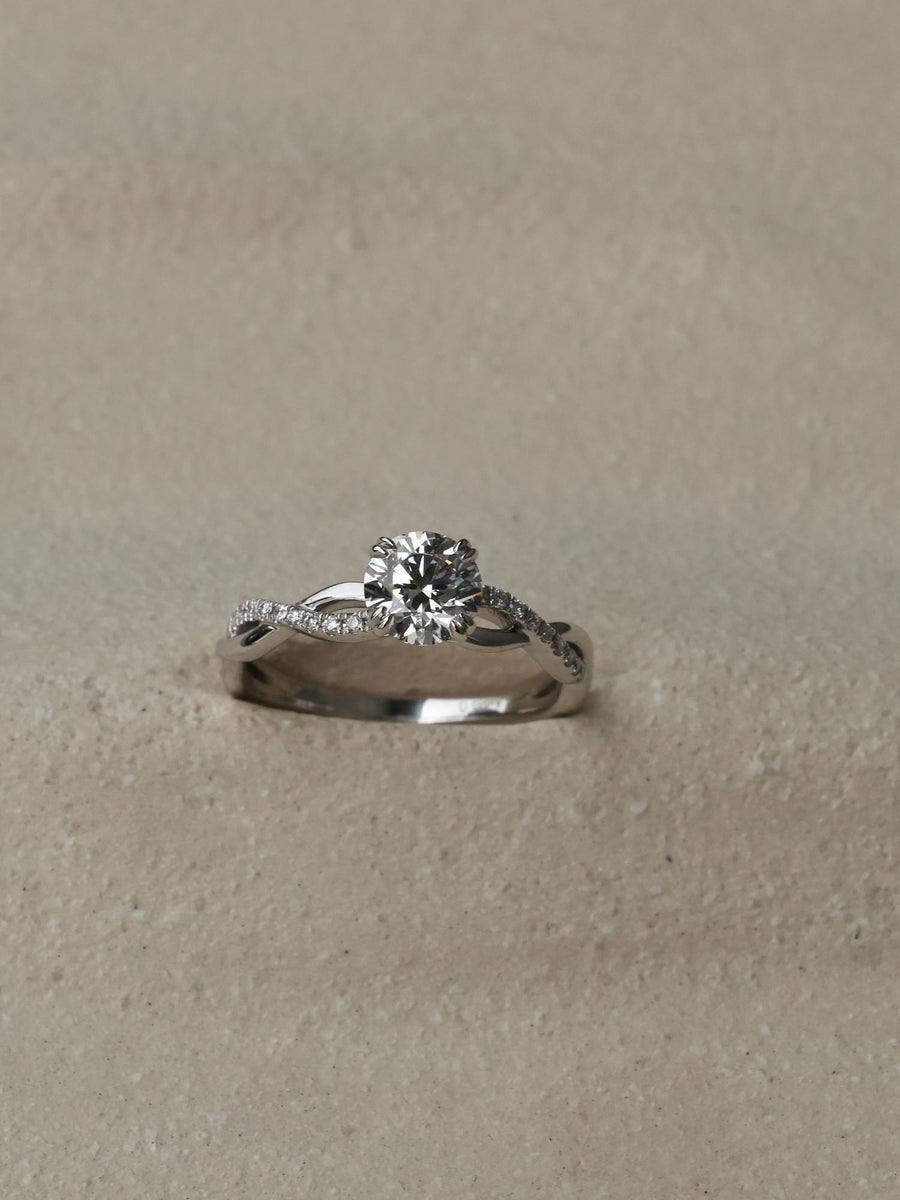 Round cut lab grown diamond twisted engagement ring, 0.70 to 2.50 carats, set in prong design with intertwined gold band