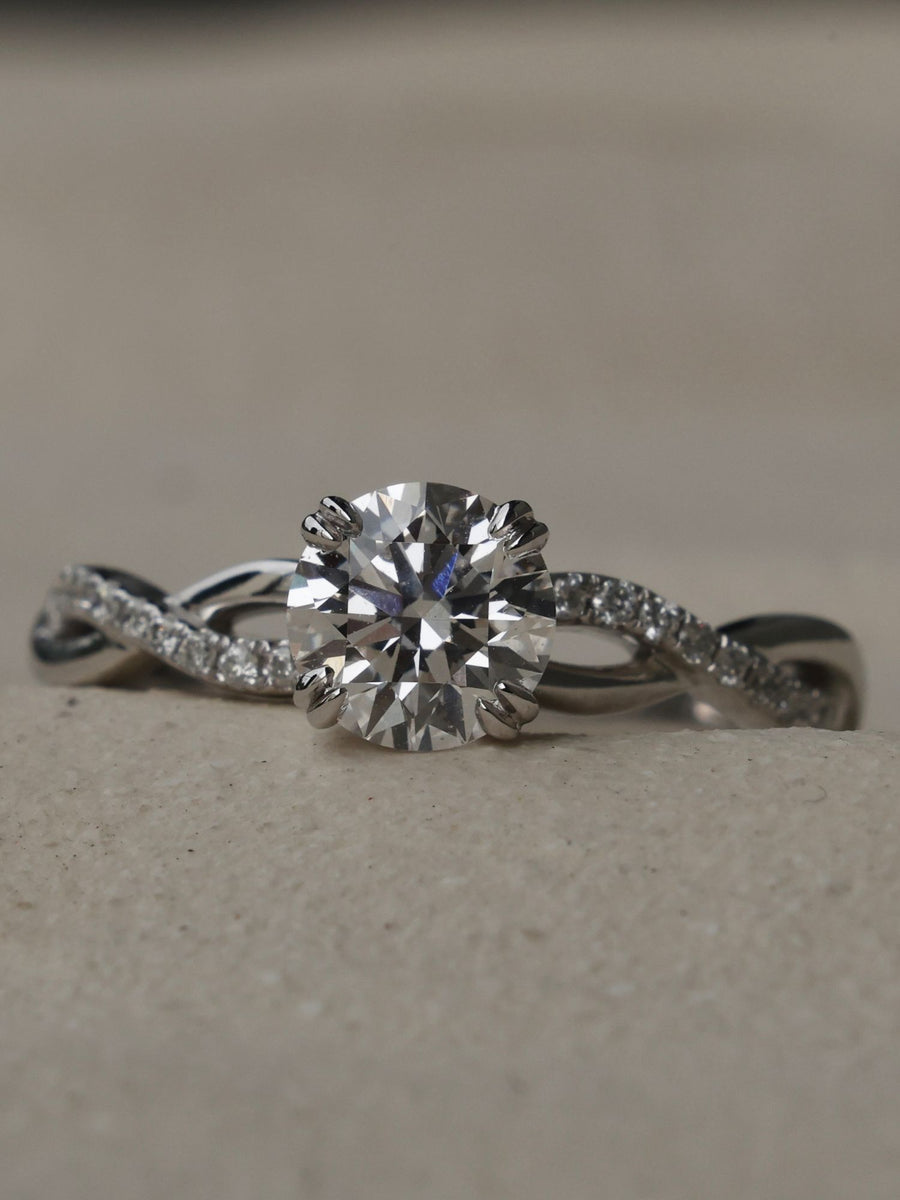 Round cut lab grown diamond twisted engagement ring, 0.70 to 2.50 carats, set in prong design with intertwined gold band