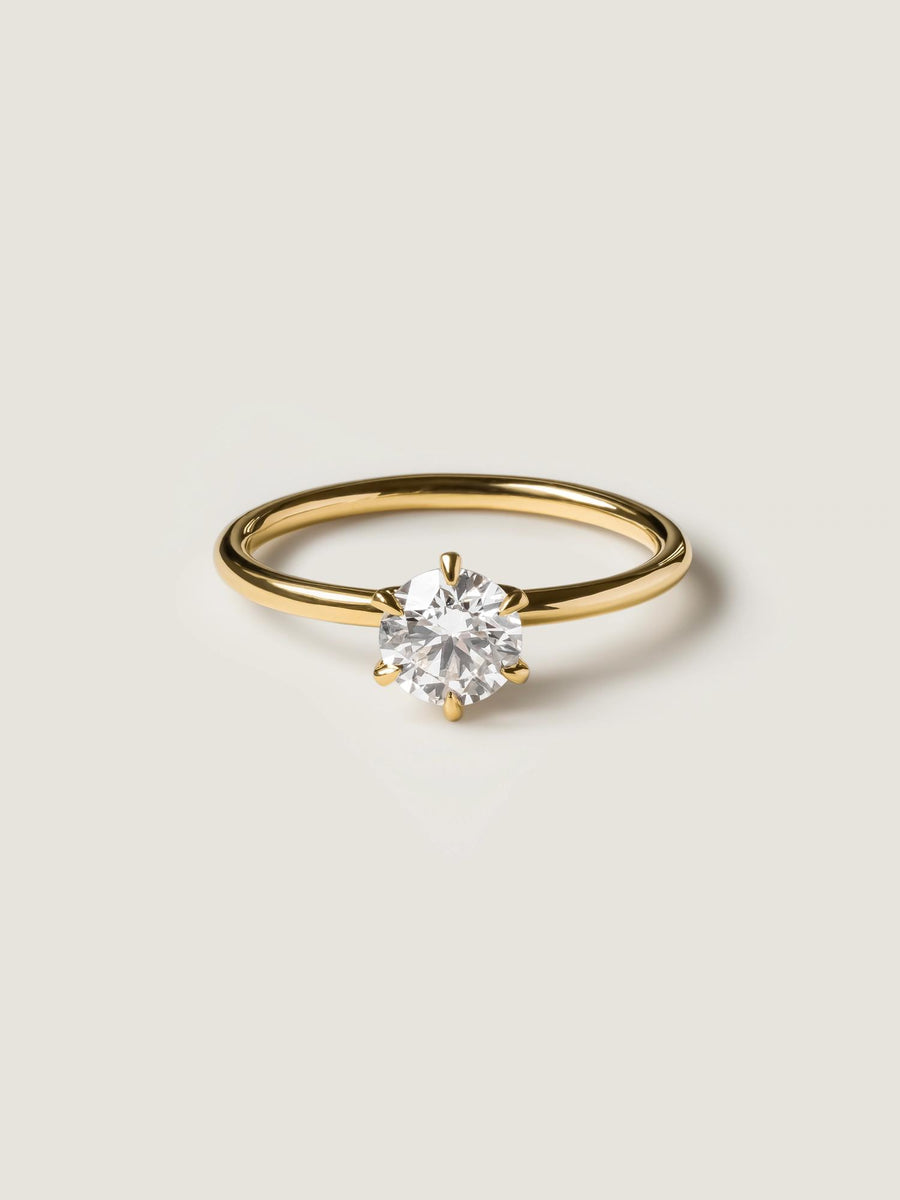 Round cut lab grown diamond solitaire engagement ring, 0.75 to 2.75 carats, set in a classic prong design on polished gold band