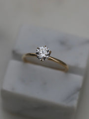 Round cut lab grown diamond solitaire engagement ring, 0.75 to 2.75 carats, set in a classic prong design on polished gold band