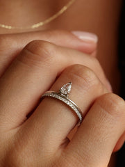 0.30 carat pear cut lab grown diamond solitaire engagement ring in prong setting on polished gold band