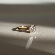 Round cut lab grown diamond solitaire engagement ring, 1.5 to 3.5 carats, set in timeless prong design on polished gold band