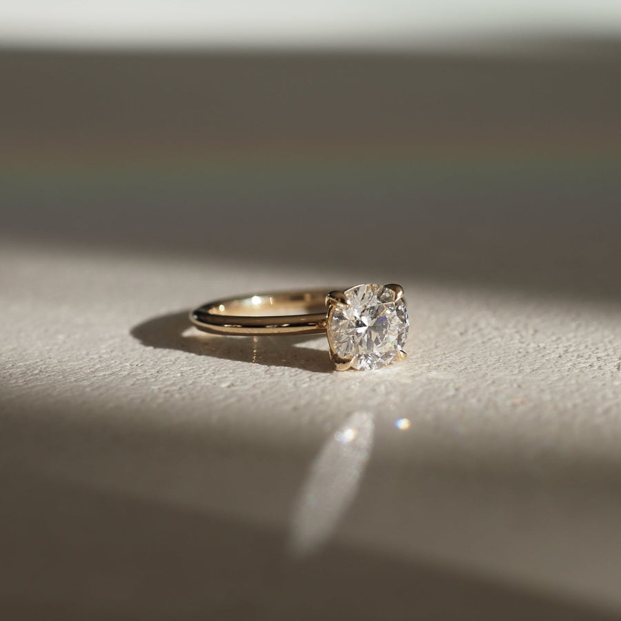 Round cut lab grown diamond solitaire engagement ring, 1.5 to 3.5 carats, set in timeless prong design on polished gold band