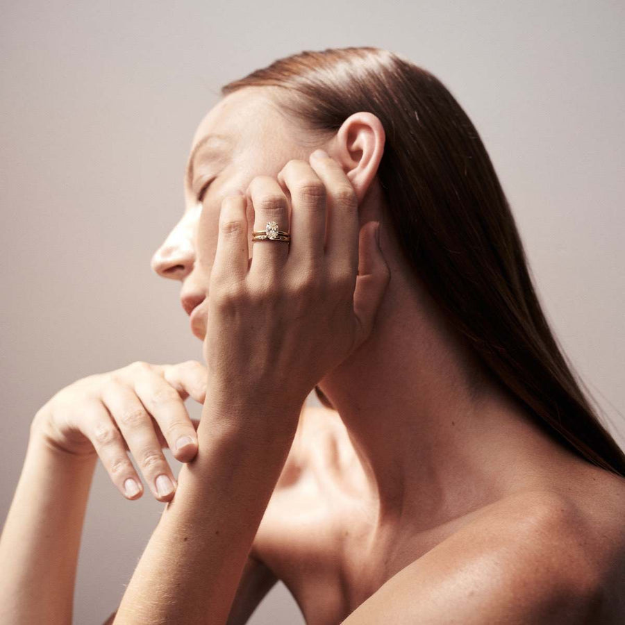 Oval cut lab grown diamond solitaire engagement ring, 1.5 to 3.5 carats, set in elegant prong setting on polished gold band