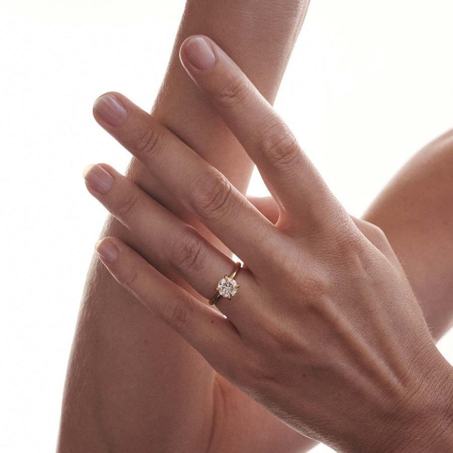 Round cut lab grown diamond solitaire engagement ring, 1.5 to 3.5 carats, set in timeless prong design on polished gold band