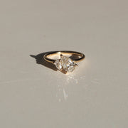 1.5 carat pear cut lab grown diamond two stone engagement ring with G/VS clarity, set in polished gold band with prong setting