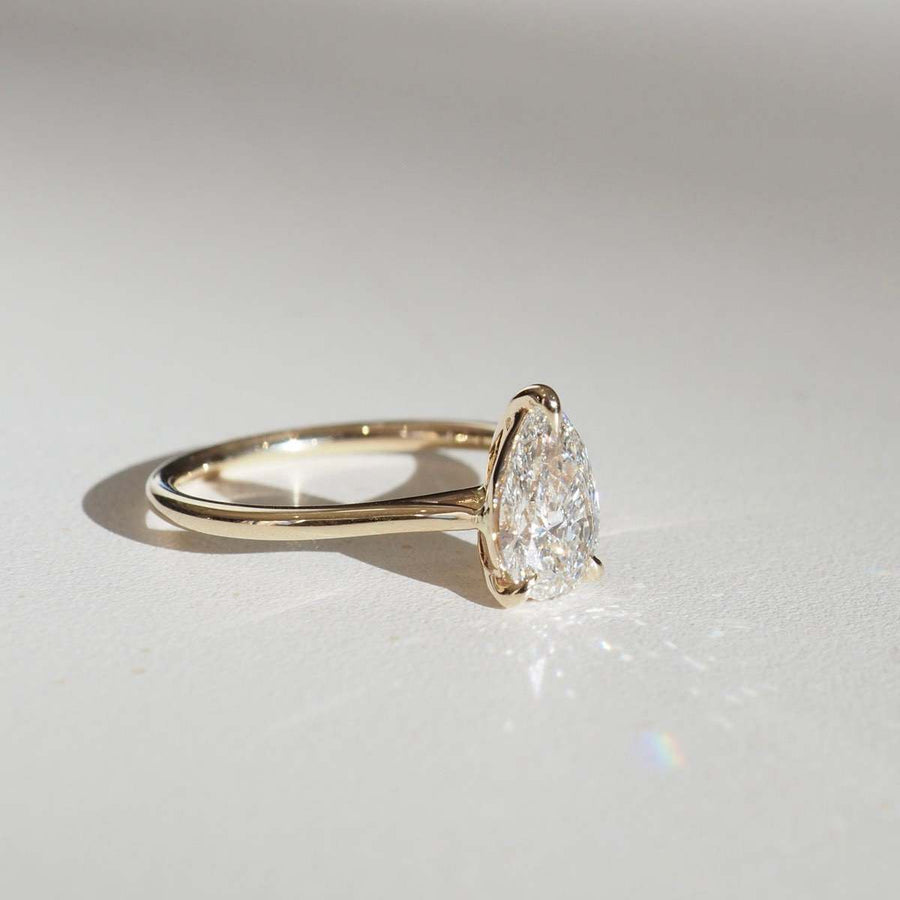 Pear cut lab grown diamond solitaire engagement ring, 1.5 to 3.5 carats, set in elegant prong setting on polished gold band