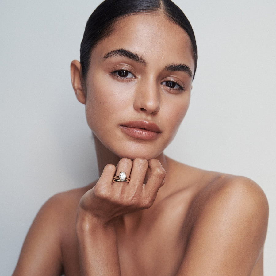 Oval cut lab grown diamond solitaire engagement ring, 1.5 to 3.5 carats, set in elegant prong setting on polished gold band