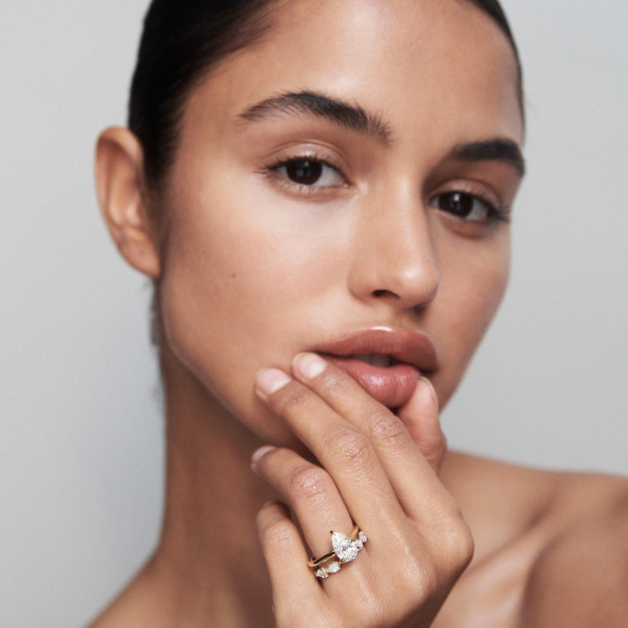 Pear cut lab grown diamond solitaire engagement ring, 1.5 to 3.5 carats, set in elegant prong setting on polished gold band