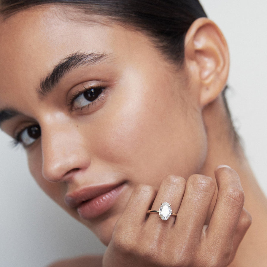 Oval cut lab grown diamond solitaire engagement ring, 1.5 to 3.5 carats, set in elegant prong setting on polished gold band