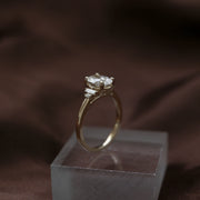 Oval cut lab grown diamond engagement ring with multiple accent stones set in polished band for added brilliance