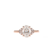 Oval cut lab grown diamond engagement ring with multiple accent stones set in polished band for added brilliance