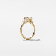 1.29 carat emerald cut lab grown diamond three stone engagement ring in G/VS1 clarity with baguette side stones and polished metal band