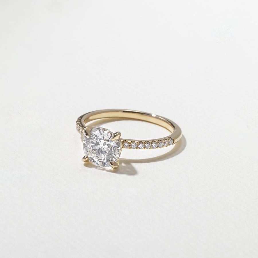 1.52 to 3.52 carat round lab grown diamond engagement ring with G/VS2 clarity and pave-set diamonds on a refined, polished band

