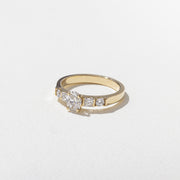 0.50 carat oval cut lab grown diamond five stone engagement ring in classic prong setting on polished gold band