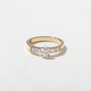 0.50 carat oval cut lab grown diamond five stone engagement ring in classic prong setting on polished gold band