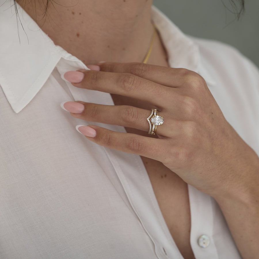 2.04 to 4.04 carat oval lab grown diamond solitaire ring in G/VS1 clarity set in a classic four-prong setting with polished metal band

