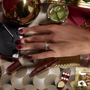 0.50 carat oval cut lab grown diamond five stone engagement ring in classic prong setting on polished gold band