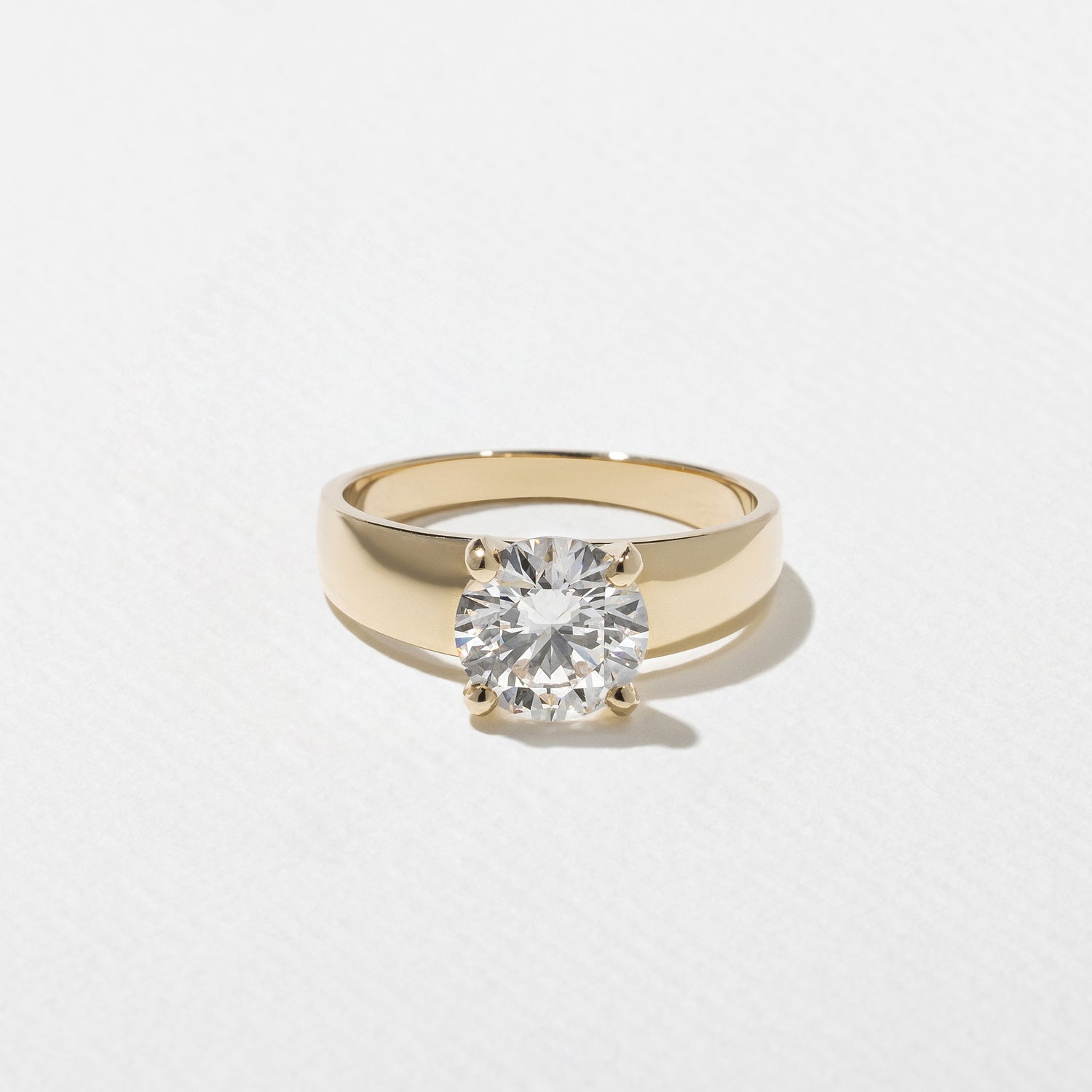 Round cut lab grown diamond solitaire engagement ring in G/VS1 clarity, available in 1.55 to 3.55 carat sizes, set in a timeless prong setting