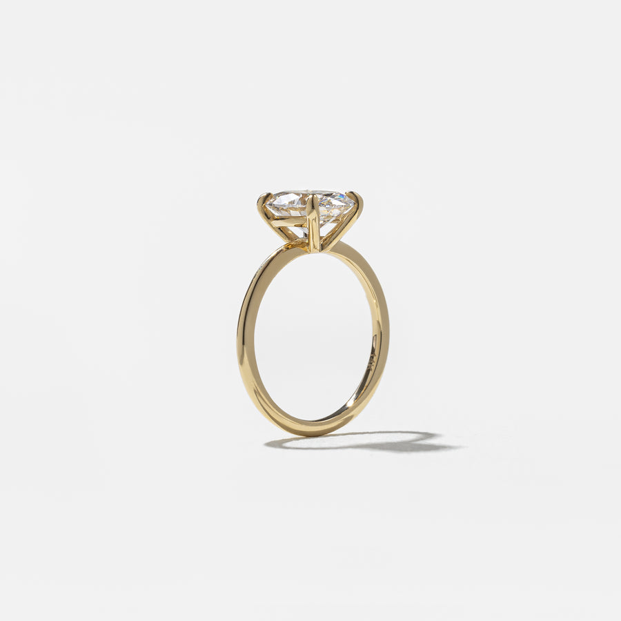 2.04 to 4.04 carat oval lab grown diamond solitaire ring in G/VS1 clarity set in a classic four-prong setting with polished metal band

