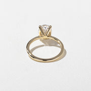 2.04 to 4.04 carat oval lab grown diamond solitaire ring in G/VS1 clarity set in a classic four-prong setting with polished metal band

