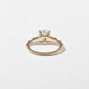 1.35 to 3.35 carat cushion cut lab grown diamond solitaire ring in G/VS1 clarity with soft edges and a polished metal four-prong setting

