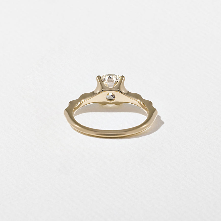 1.35 to 3.35 carat cushion cut lab grown diamond solitaire ring in G/VS1 clarity with soft edges and a polished metal four-prong setting

