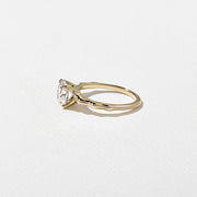 1.35 to 3.35 carat cushion cut lab grown diamond solitaire ring in G/VS1 clarity with soft edges and a polished metal four-prong setting

