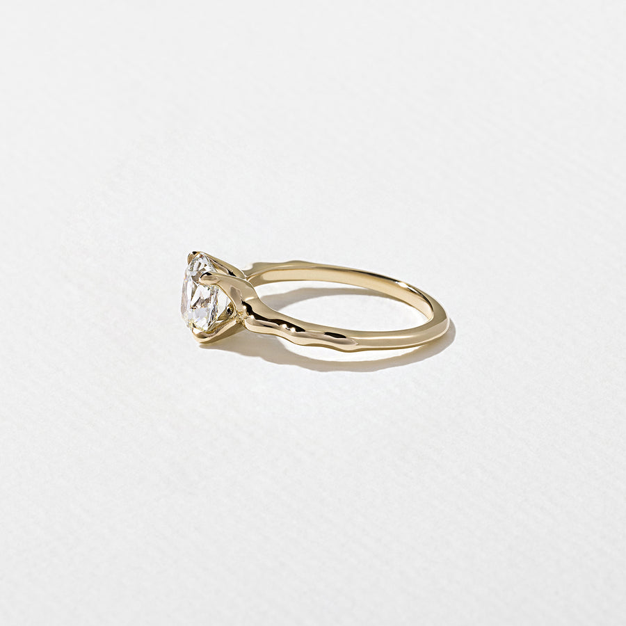 1.35 to 3.35 carat cushion cut lab grown diamond solitaire ring in G/VS1 clarity with soft edges and a polished metal four-prong setting

