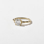 1.35 to 3.35 carat cushion cut lab grown diamond solitaire ring in G/VS1 clarity with soft edges and a polished metal four-prong setting

