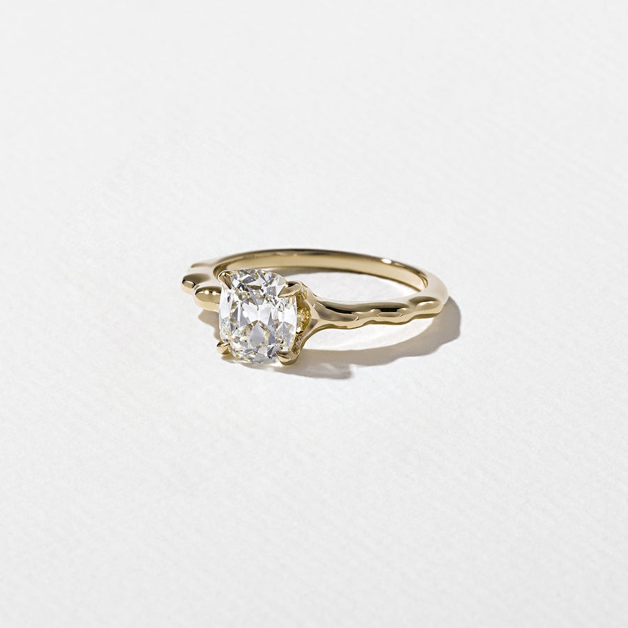 1.35 to 3.35 carat cushion cut lab grown diamond solitaire ring in G/VS1 clarity with soft edges and a polished metal four-prong setting

