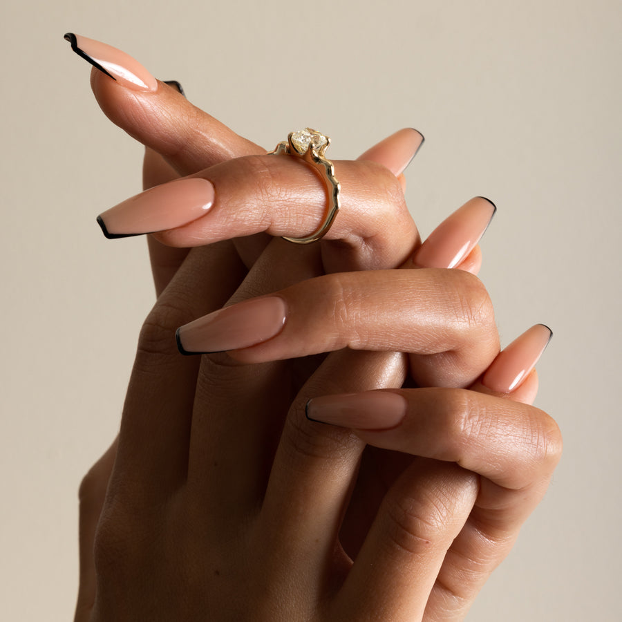 1.35 to 3.35 carat cushion cut lab grown diamond solitaire ring in G/VS1 clarity with soft edges and a polished metal four-prong setting

