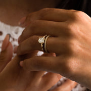 1.35 to 3.35 carat cushion cut lab grown diamond solitaire ring in G/VS1 clarity with soft edges and a polished metal four-prong setting

