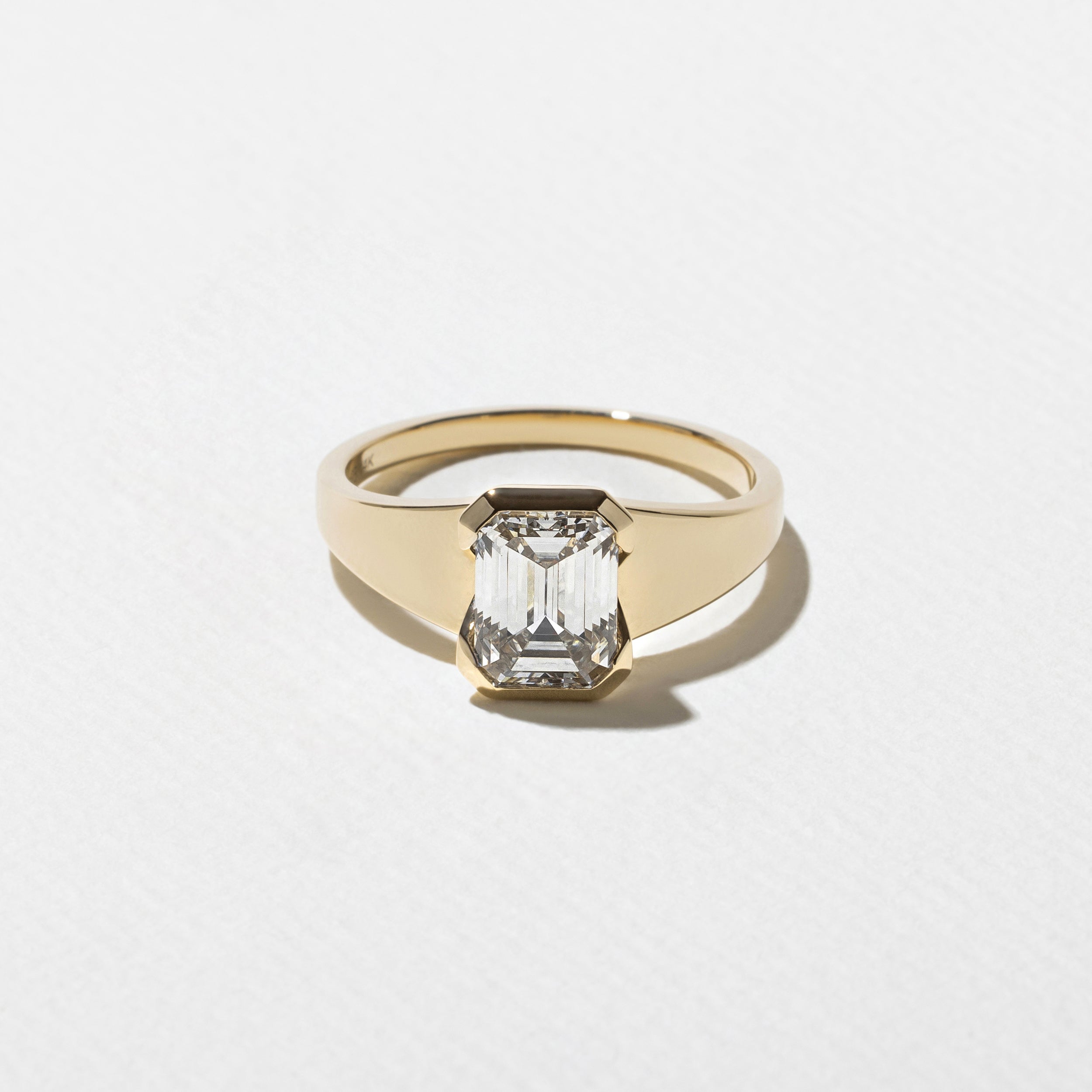 Emerald cut lab grown diamond solitaire engagement ring with half bezel setting, F color, VS1 clarity, 1.55–3.55 carat