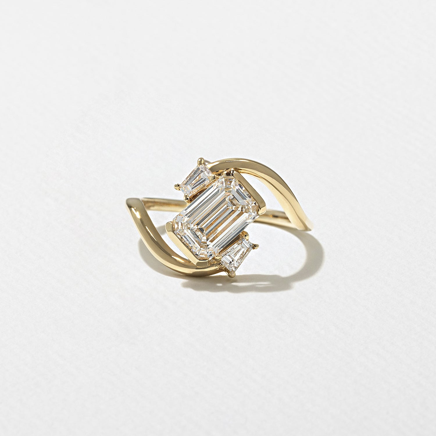 1.59 carat emerald cut CVD lab grown diamond three stone engagement ring in F color and VVS2 clarity