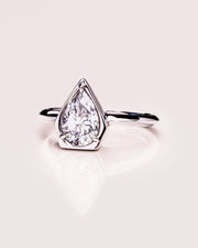 1.33 CT Pear Cut Bezel Solitaire Moissanite Engagement Ring - Barbara Maison 